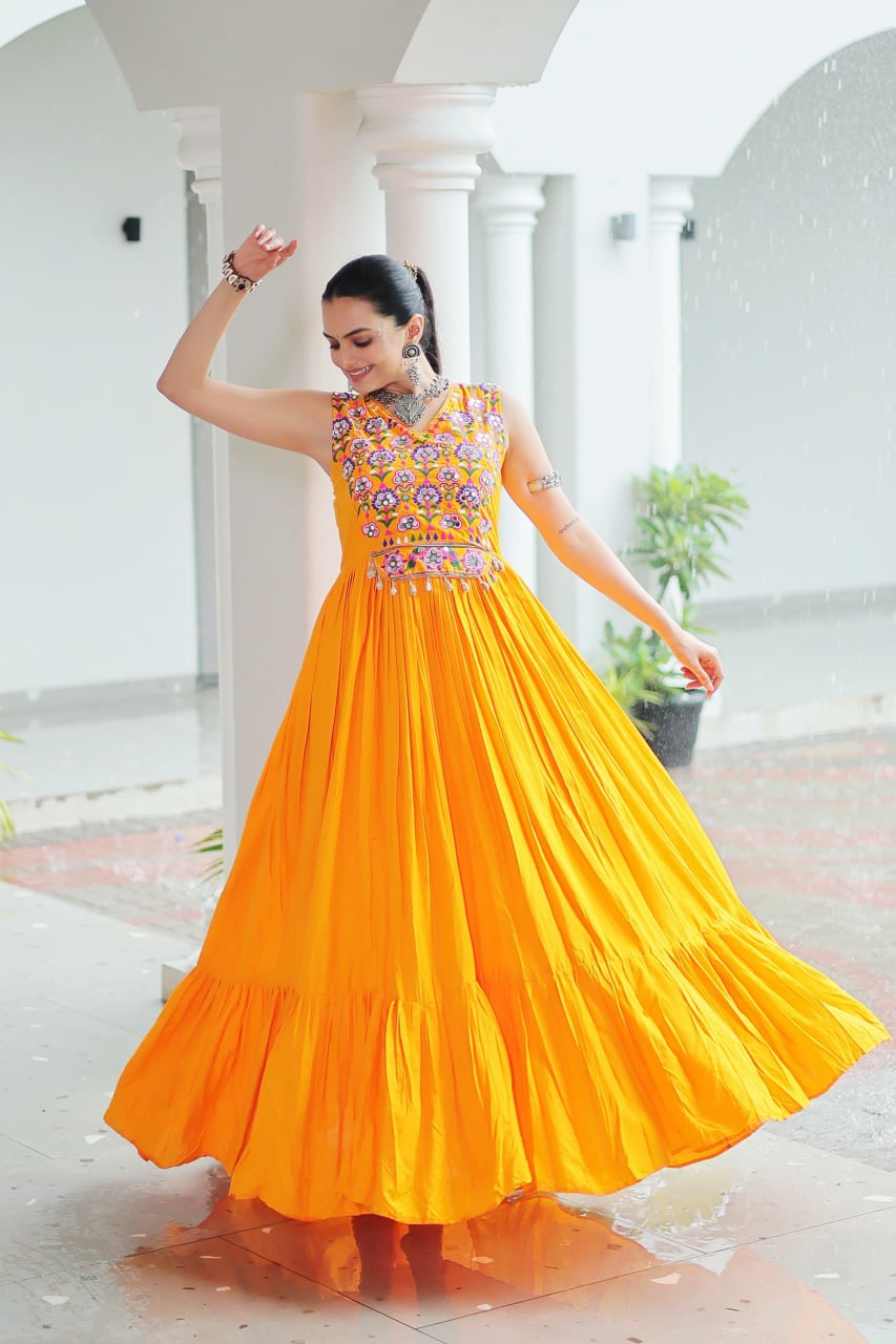 Yellow Rayon Navratri Gown with Kutchi Gamthi Embroidery & Mirror Work – Sleeveless with Flair