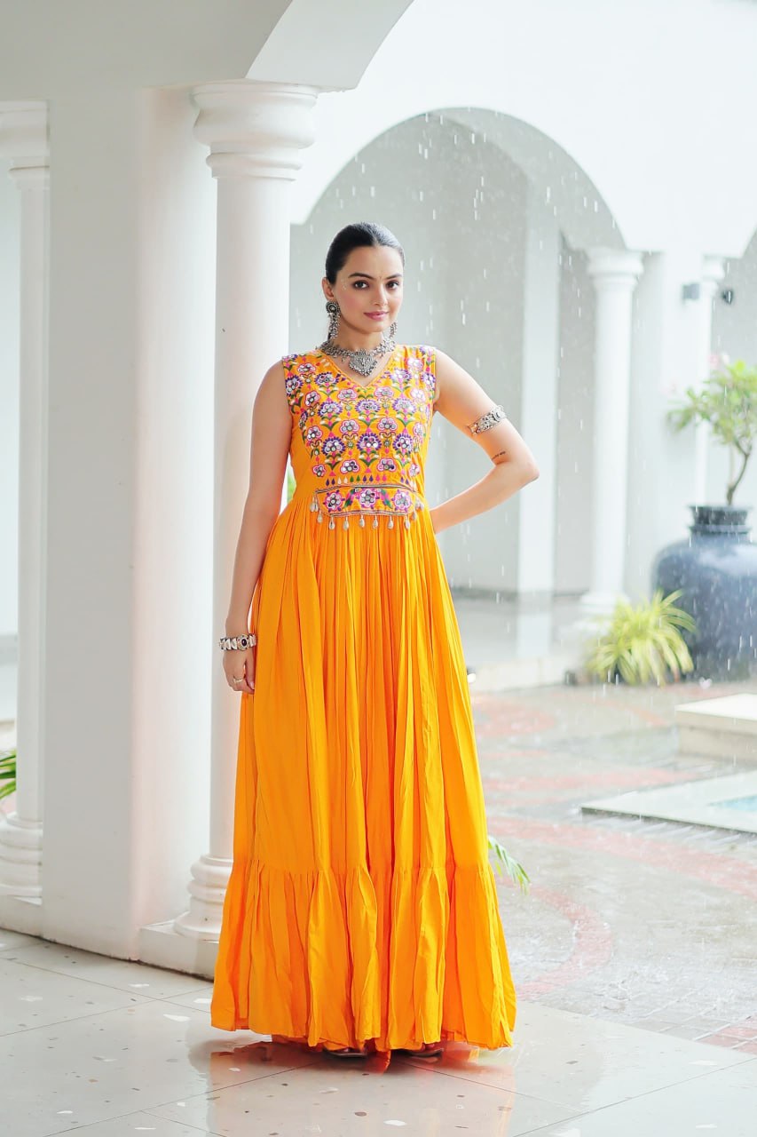 Yellow Rayon Navratri Gown with Kutchi Gamthi Embroidery & Mirror Work – Sleeveless with Flair