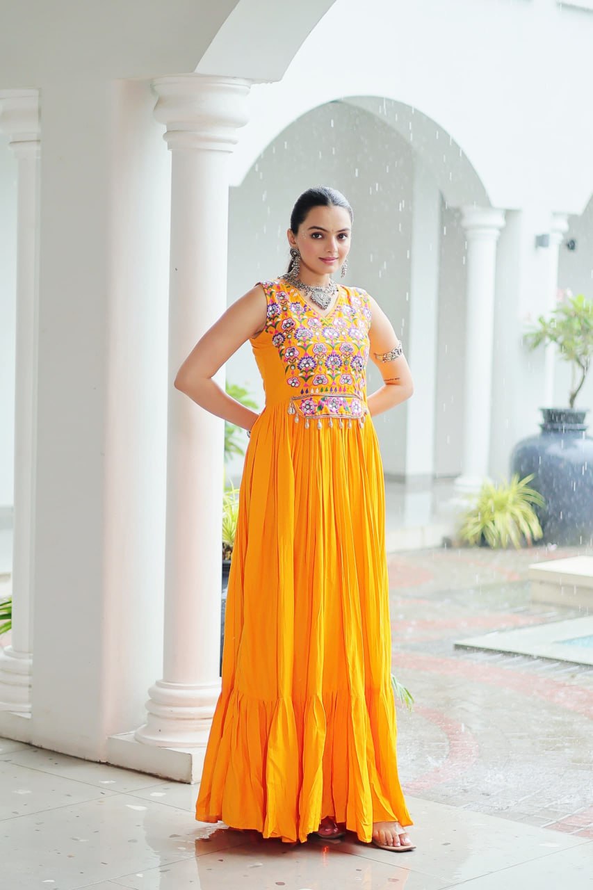 Yellow Rayon Navratri Gown with Kutchi Gamthi Embroidery & Mirror Work – Sleeveless with Flair