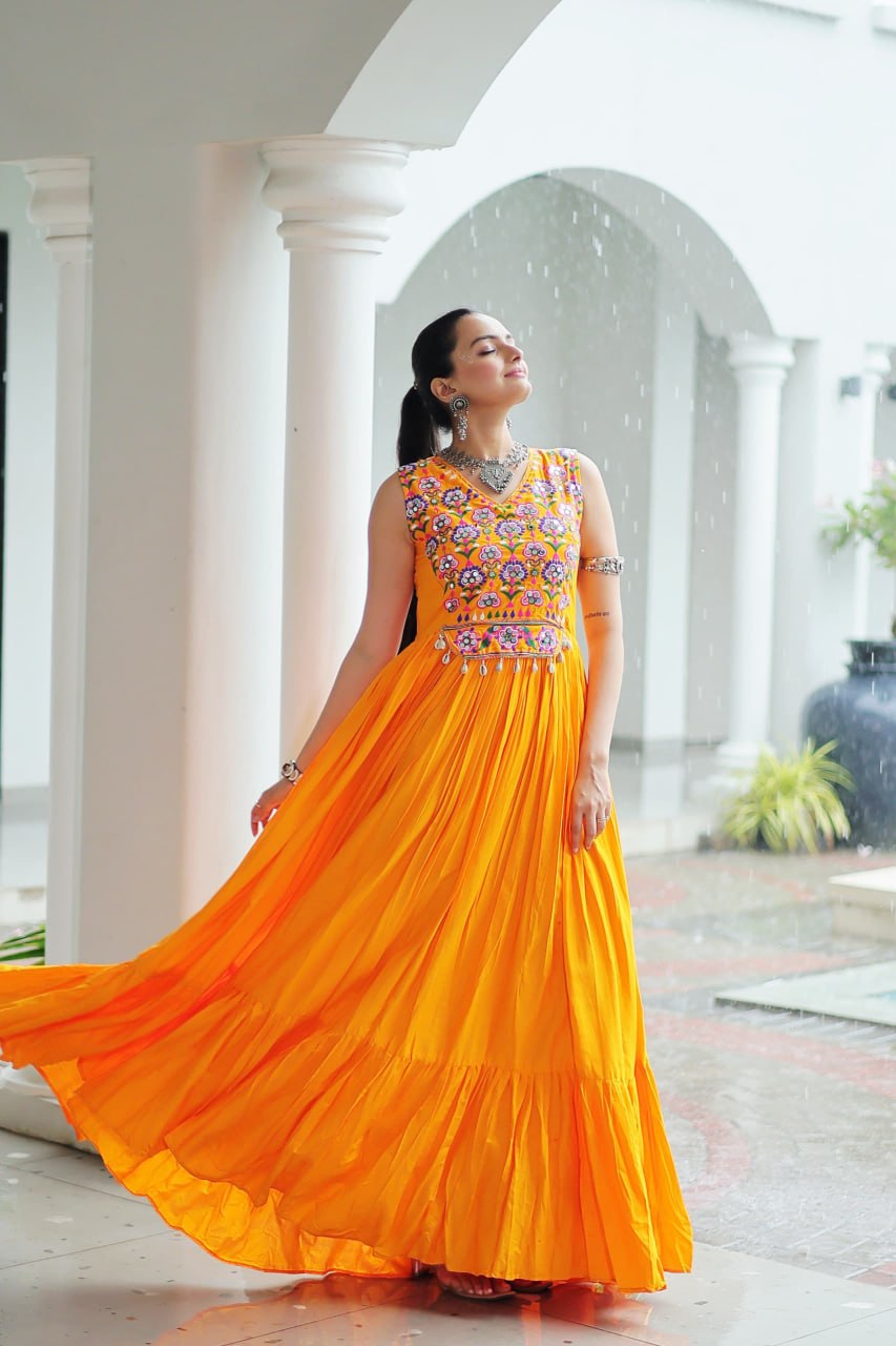 Yellow Rayon Navratri Gown with Kutchi Gamthi Embroidery & Mirror Work – Sleeveless with Flair