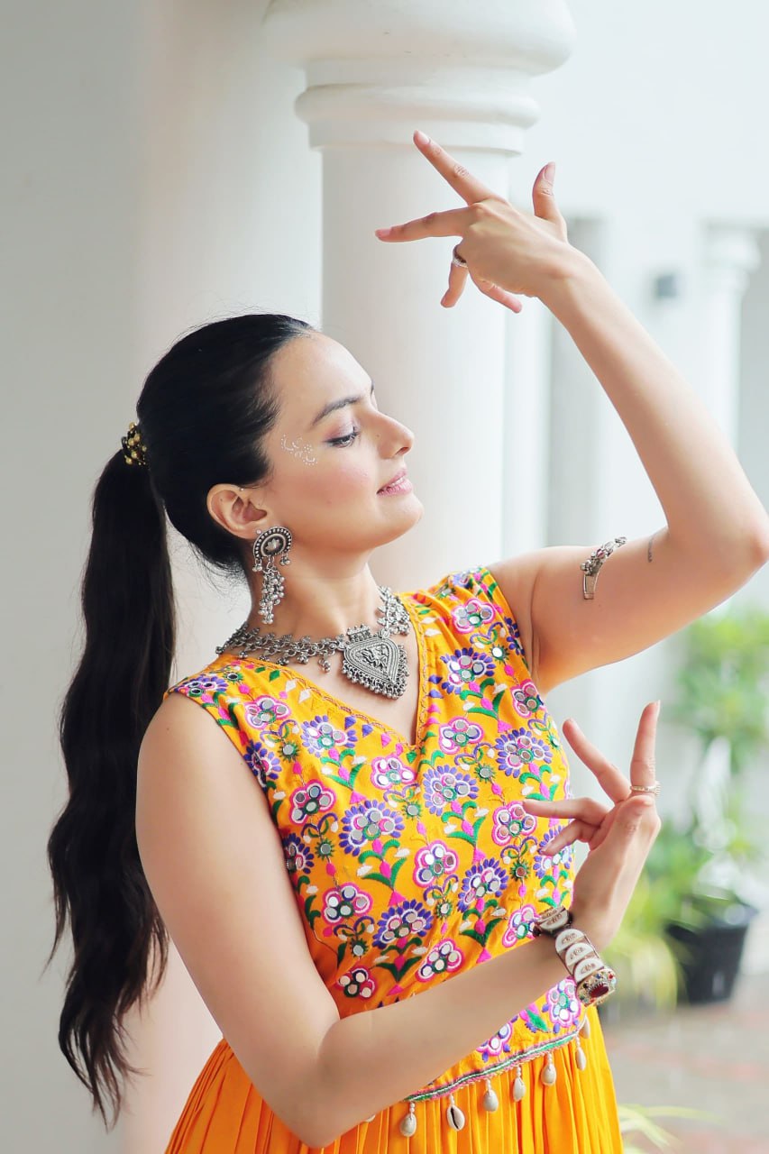Yellow Rayon Navratri Gown with Kutchi Gamthi Embroidery & Mirror Work – Sleeveless with Flair