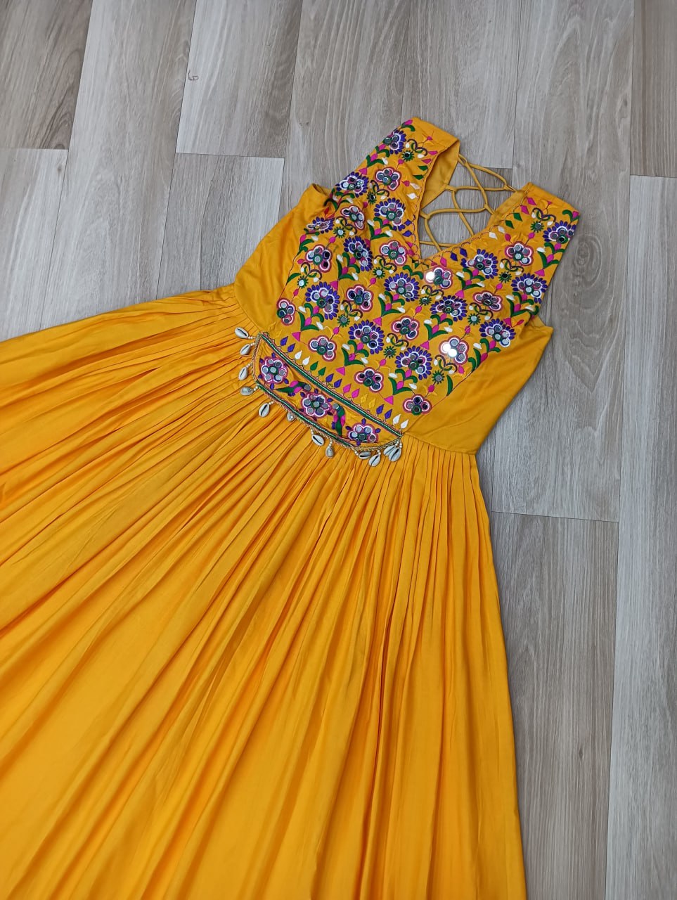 Yellow Rayon Navratri Gown with Kutchi Gamthi Embroidery & Mirror Work – Sleeveless with Flair