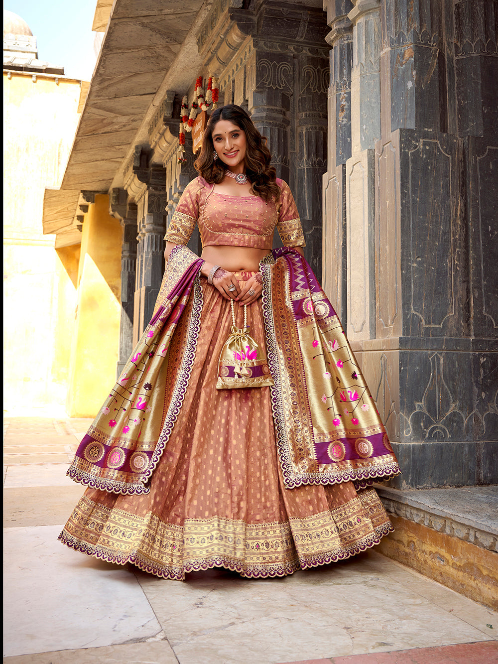 Peach shimmer organza lehenga choli with zari weaving paithani dupatta purse